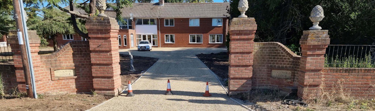 This is a photo of a newly installed chip and tar driveway, installed by NS Driveways Cobham
